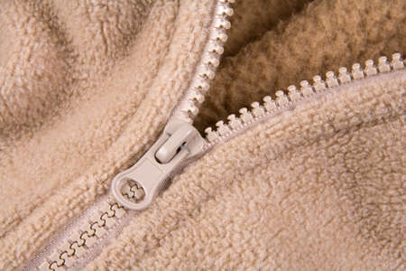 Detail of zip in a brown jacket の写真素材
