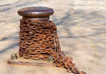 Old mooring bollard with a rusty chain  Prague  Czech republic の写真素材