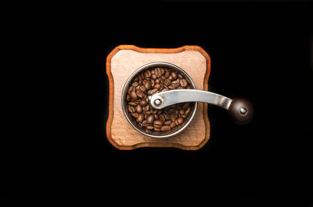 Coffee mill isolated on black backgroundの写真素材