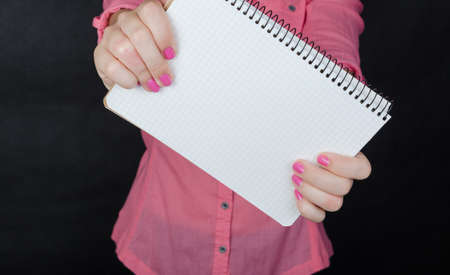 Young woman in pink shirt working
