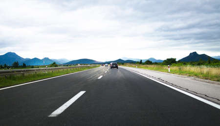 Trip with a car on highwayの写真素材