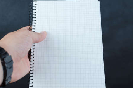 Business man holding his notes