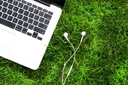 Listening music on laptop outside