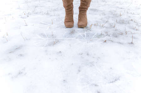 Human step on frosted groundの写真素材