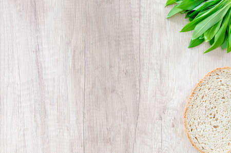 Fresh bear garlic on wooden tableの写真素材