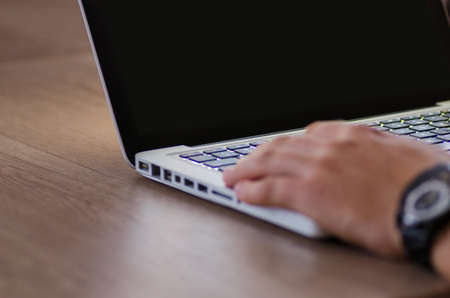 Man working on laptop in officeの写真素材