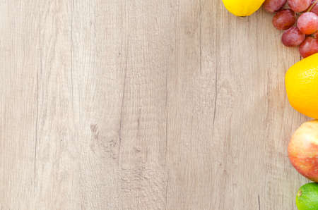 Mix fruits on wooden tableの写真素材
