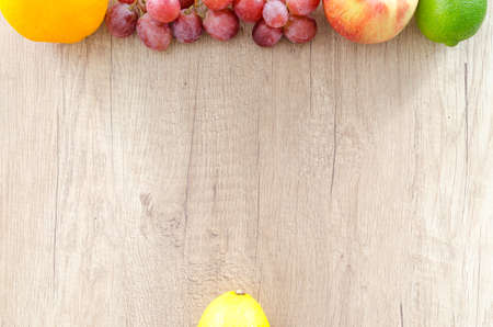 Mix fruits on wooden tableの写真素材