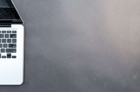 Workplace with notebook on black backgroundの写真素材