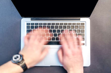 Workplace with notebook on black backgroundの写真素材