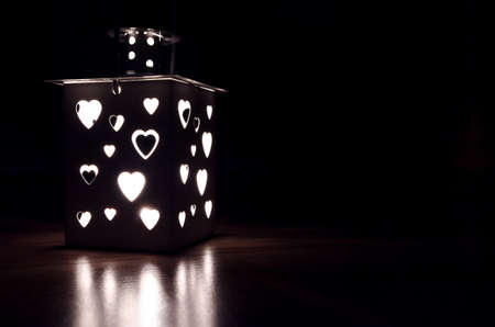 Lantern glow on wood backgroundの写真素材