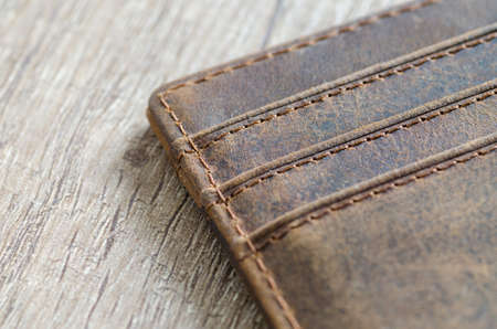 Leather wallet on wooden tableの写真素材