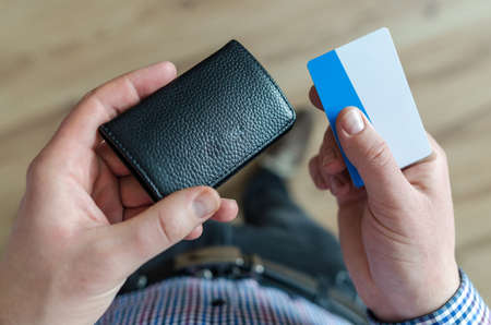 Man holding leather walletの写真素材