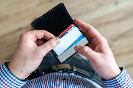 Man holding leather walletの写真素材
