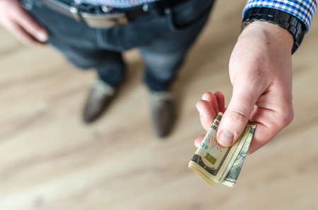 Man holding cash interior