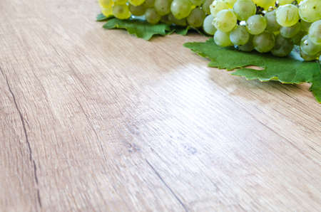 Wine grapes on wooden tableの写真素材