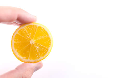 Man holding sliced lemonの写真素材