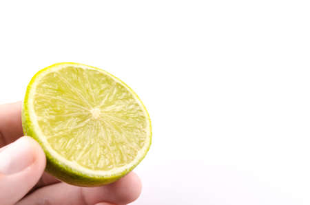 Man holding sliced lime