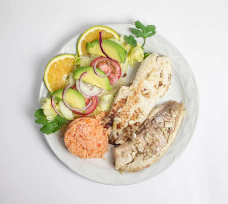 Salmon fillet with vegetable salad on white background, top viewの写真素材