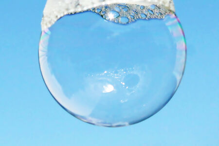 soapy bubble in sky blue background 