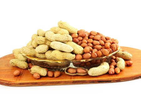 peanuts whole and peeled in white backgroundの写真素材