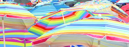 Colorful umbrella closeup on beachの写真素材