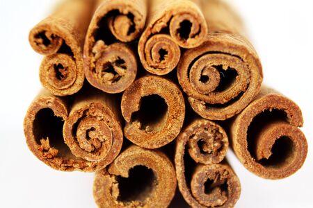 Cinnamon sticks closeup on white background