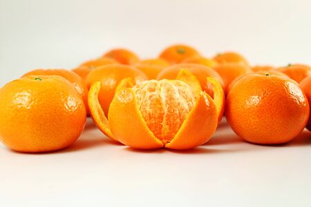 Ripe mandarin  tangerine orange closeup on a white backgroundの写真素材