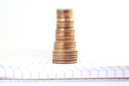 money or coin graph or money growing or saving concept on white backgroundの写真素材