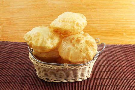 puri or Poori traditional indian homemade deep fried bread or chapati