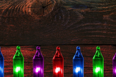 colorful flashing lights on wooden vintage background with copy spaceの写真素材