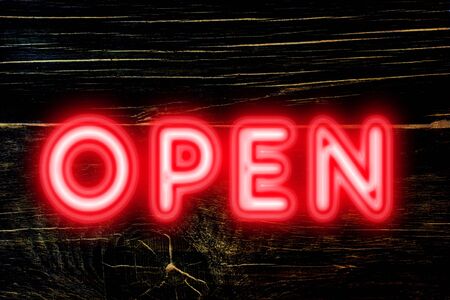 open neon sign for welcome to customers conceptの写真素材