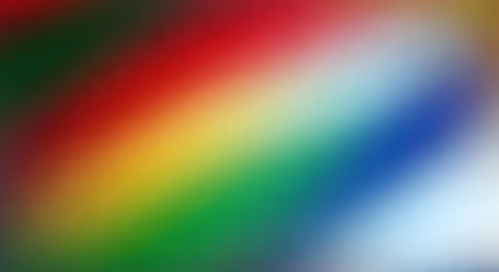 A vibrant and colorful abstract background featuring a blurred and pixelated diagonal rainbow gradient. The mosaic texture creates a modern and digital feel.の素材