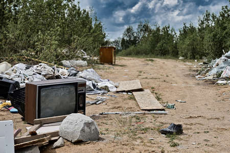 Photo of garbage and garbage outdoors. Frame made in cloudy weather.