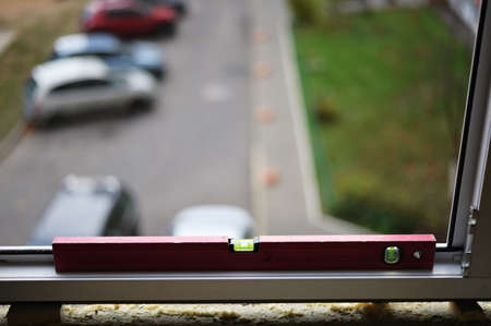 Photo of a tool for mounting a pvc window in a city apartment