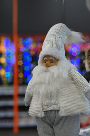 Close-up Photo of New Years white figures of Santa Claus on a blurred backgroundの写真素材