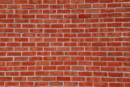 A strong wall of red brick.