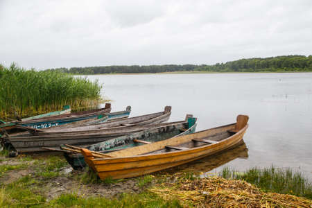 Some boats at the seashore on a cloudy dayの写真素材