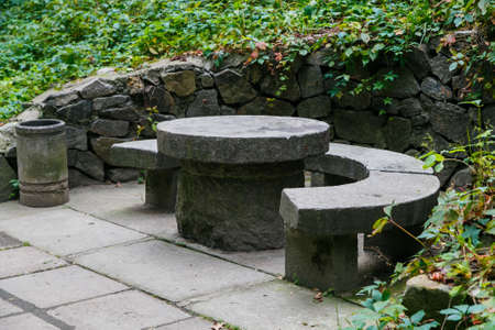 Stone table with benches in the park