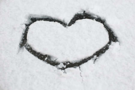 Heart on the white snowの写真素材