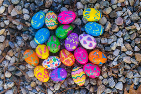 Colourfull easter eggs on gravelの写真素材