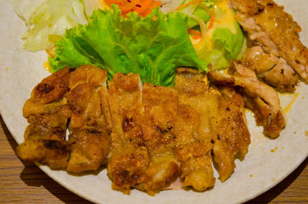 Roast chicken with crispy skin in soy sauce. Japanese cuisine.の写真素材