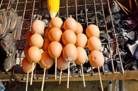 Grilled egg and potato in Thai rural marketの写真素材
