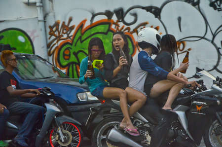 Bangkok / Thailand - 13 April 2012: The government tries to prevent casualties in Songkran. But it seems useless, when people still drink alcohol and act unsafe on their vehicles.のeditorial素材