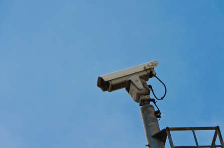 Security camera on the high ground with blue sky backgroundの写真素材