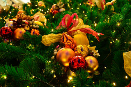 Colorful Christmas tree decoration with ornaments and lightsの写真素材