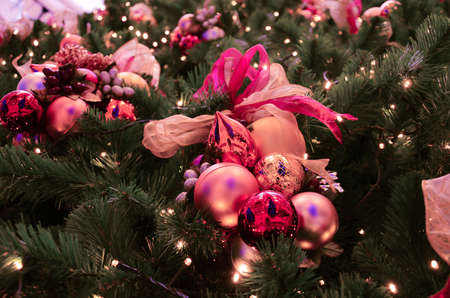 Colorful Christmas tree decoration with ornaments and lightsの写真素材