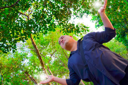 An office guy is receiving force of nature to heal himself.の写真素材