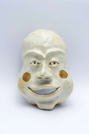 Ancient Tribal Mask on white Backgroundの写真素材