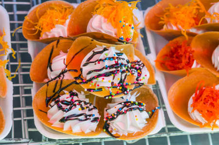 Thai Style Crisp Tart on tray in an open marketの写真素材